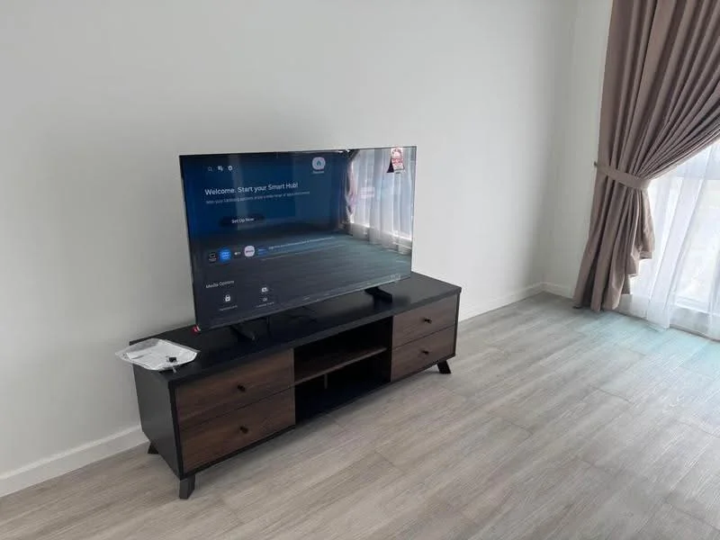 Living features: wall-mounted TV, TV console in dark wood, light grey laminate flooring, floor-to-ceiling windows, sheer curtains, decorative wall, neutral painted walls, area rug; style: modern.