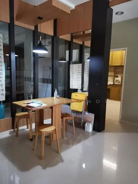 Dining features: wooden dining table, three wooden stools, pendant lighting, glass wall partitions, cream painted walls, polished tile flooring, decorative wall art, open layout to kitchen; style: modern. Kitchen features: kitchen cabinets, countertop, appliances visible in background.