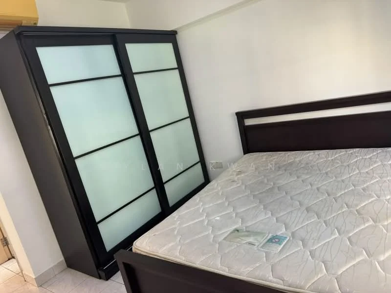 Bedroom features: queen-size bed, upholstered headboard, black wooden wardrobe with frosted glass panels, white tiled flooring, white walls, window with natural light, mattress without bedding, decorative item on the bed; style: modern.