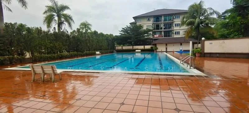Exterior type: swimming pool deck; features: rectangular swimming pool, tile pool deck, surrounded by palm trees, landscaped greenery, poolside benches, water depth markings, diving board, pool lighting, residential building in background, overcast sky; style: modern.
