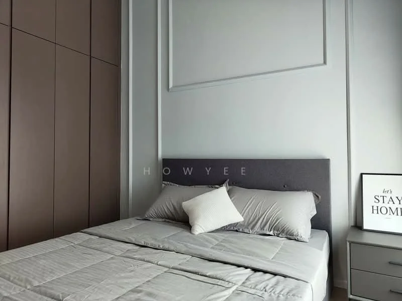 Bedroom features: queen-size bed with grey upholstered headboard, light grey bedding, decorative throw pillow, built-in wardrobe with brown wood finish, white painted walls, framed artwork on wall, nightstand with drawer, table lamp on nightstand; style: modern.