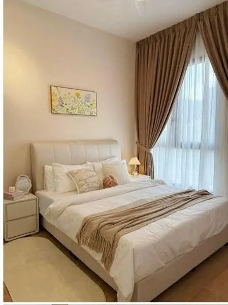 Bedroom features: king-size bed with upholstered headboard, white bedding with decorative throw, bedside table with lamp, floor-to-ceiling windows with sheer curtains, brown curtain drapes, light wood flooring, decorative wall art with floral pattern, area rug with soft texture; style: modern.