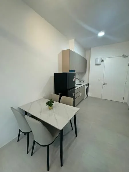 Kitchen features: grey cabinetry, white marble countertop, black fridge, built-in washing machine, stainless-steel sink, chrome faucet, 4-seater dining table, beige upholstered dining chairs, tile flooring, white walls, recessed ceiling lights; style: modern.