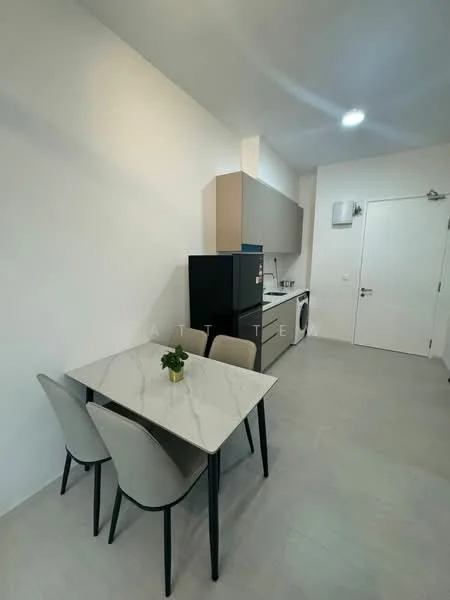 Kitchen features: grey cabinetry, white marble dining table, 4 dining chairs, black refrigerator, built-in oven, washing machine, stainless-steel sink, chrome faucet, light grey tiled flooring, white walls, recessed ceiling lights; style: modern.