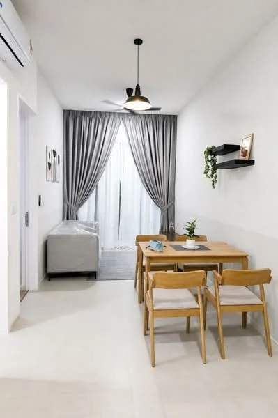 Dining features: dining table with 4 wooden chairs, grey fabric sofa, floor-to-ceiling windows with sheer curtains, light grey area rug, wall-mounted shelf with decorative items, ceiling fan with light, white painted walls, tile flooring; style: modern.