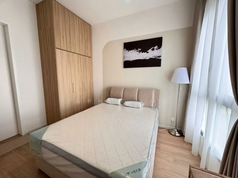 Bedroom features: queen-size bed, upholstered headboard, two bedside pillows, built-in wardrobe with wood finish, laminate flooring, floor-to-ceiling window with sheer curtains, decorative wall art, table lamp; style: modern.