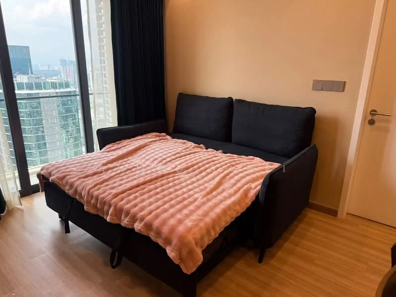 Living features: black fabric sofa, throw blanket in pink, wooden flooring, floor-to-ceiling windows, city view, light-colored walls, curtains in dark color, side table, light switch panel; style: modern; view: city.