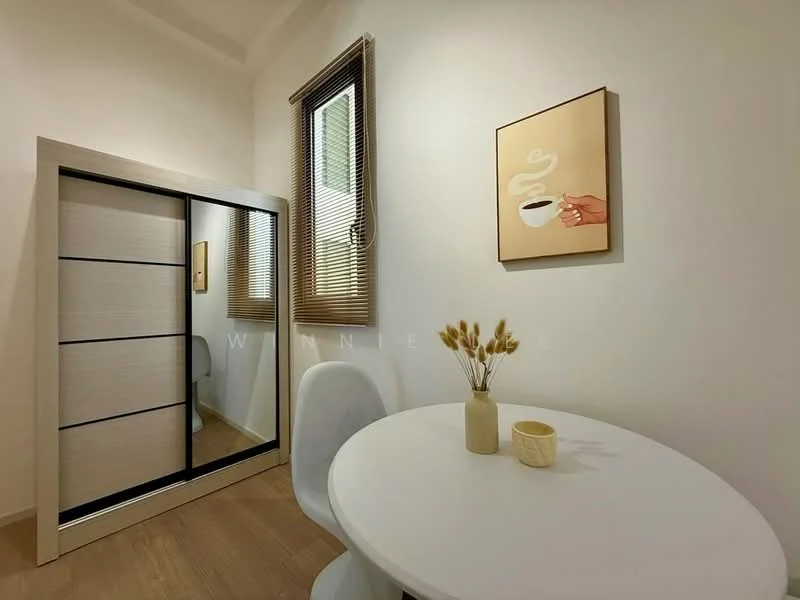 Room features: white painted walls, wooden flooring, large mirror with sliding doors, round dining table, white dining chair, framed artwork on wall, window with blinds, decorative vase with dried flowers; style: modern.