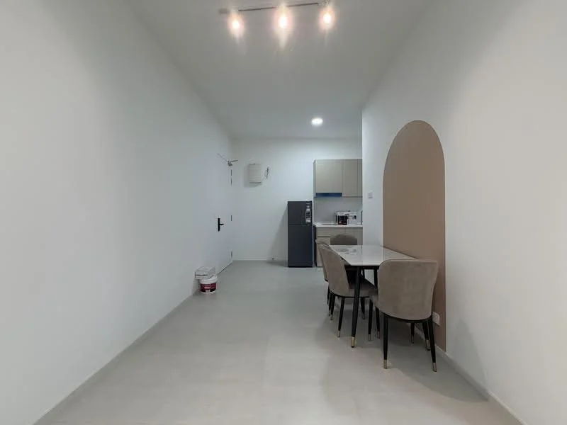 Room features: white painted walls, light grey flooring, arched wall feature, dining table with four chairs, refrigerator, kitchen cabinetry, built-in kitchen appliances, recessed ceiling lights; style: modern.