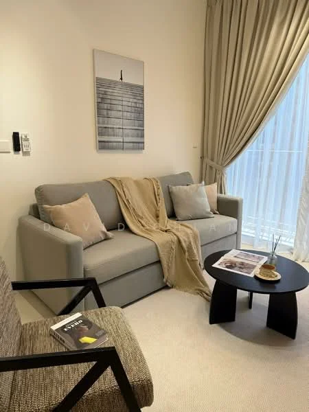 Living features: 3-seater fabric sofa in grey, decorative throw blanket, 2 accent pillows, black coffee table, framed artwork on wall, floor-to-ceiling window with sheer curtains, beige carpet flooring, armchair with textured fabric; style: modern.