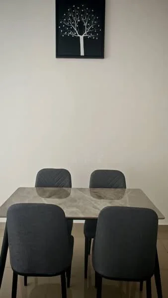 Dining features: marble dining table, 4 upholstered dining chairs in grey, white painted walls, decorative wall art with tree design, tile flooring; style: modern.