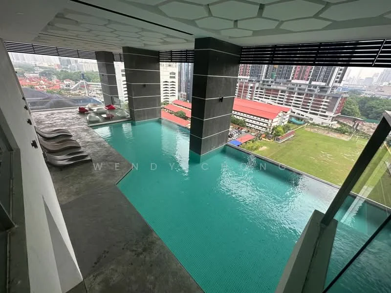Exterior type: high-rise condominium; features: infinity pool, pool deck with loungers, glass railing, hexagonal ceiling design, city skyline view, surrounded by greenery, modern architecture; style: modern.