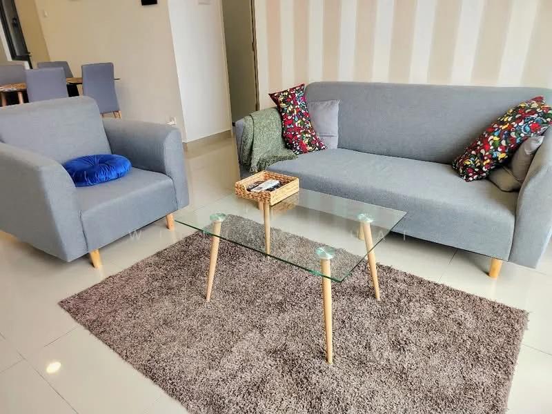 Living features: grey fabric 3-seater sofa, grey fabric armchair, glass coffee table with wooden legs, area rug with plush texture, decorative cushions with floral pattern, wall with light-colored vertical stripes, tile flooring, natural light from windows; style: modern.