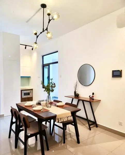 Dining features: 4-seater dining table in dark wood, black dining chairs with wooden legs, pendant light fixture with multiple bulbs, white painted walls, large round mirror on wall, decorative vase with flowers on table, table runner in neutral color, built-in cabinetry visible in background, tile flooring in light color; style: modern.