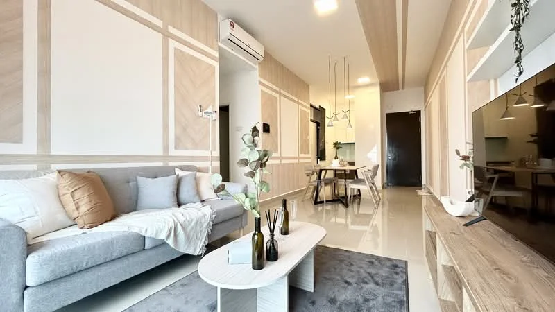 Living features: grey fabric sofa, decorative cushions in white and gold, light wood coffee table, area rug in grey, wall-mounted TV, light wood TV console, recessed ceiling lights, air conditioning unit, wall paneling with light wood accents, dining area visible in background, pendant lighting above dining table; style: modern.