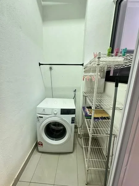 Laundry features: white front-load washing machine, metal drying rack, open shelving unit, grey tiled flooring, white painted walls, window for natural light.