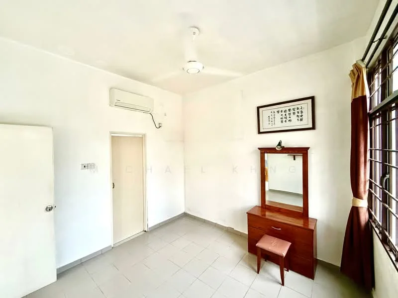 Bedroom features: white painted walls, tile flooring, 5-blade ceiling fan, wall-mounted split AC, window with brown curtains, wooden dressing table, small upholstered stool, built-in wardrobe, framed artwork on wall; style: minimalist.