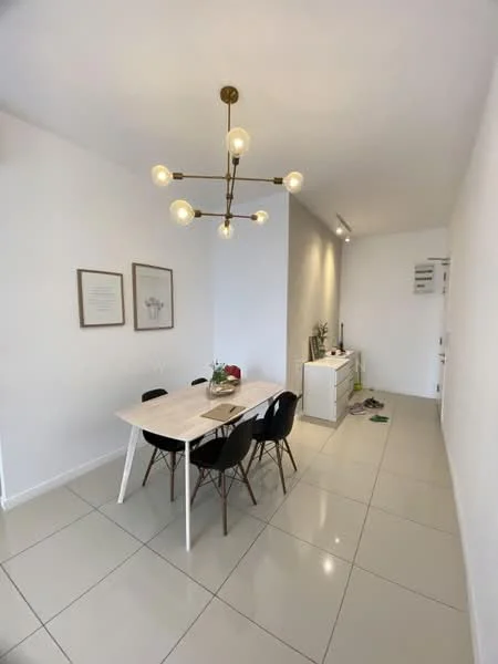 Dining features: white dining table, 4 black dining chairs, chandelier with multiple bulbs, light grey accent wall, white painted walls, large floor tiles, sideboard cabinet, decorative wall art; style: modern.