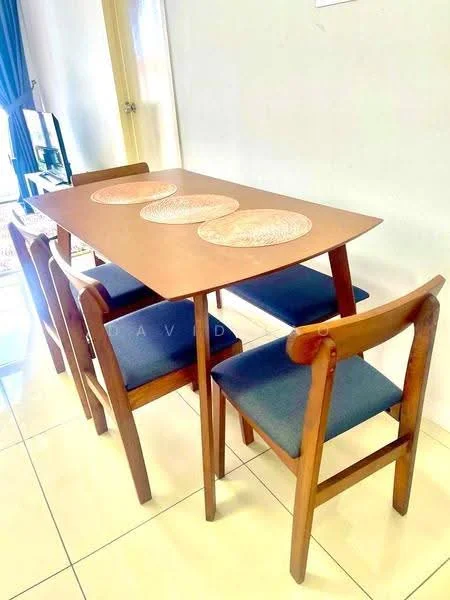 Dining features: wooden dining table, 4-seater dining table, blue upholstered dining chairs, round placemats, glossy tile flooring, neutral wall color, natural light from window, simple wooden design; style: modern.