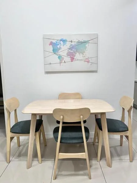 Dining features: light wood dining table, 4 wooden dining chairs, grey upholstered seat cushions, framed world map artwork on wall, white painted walls, glossy tile flooring; style: modern.
