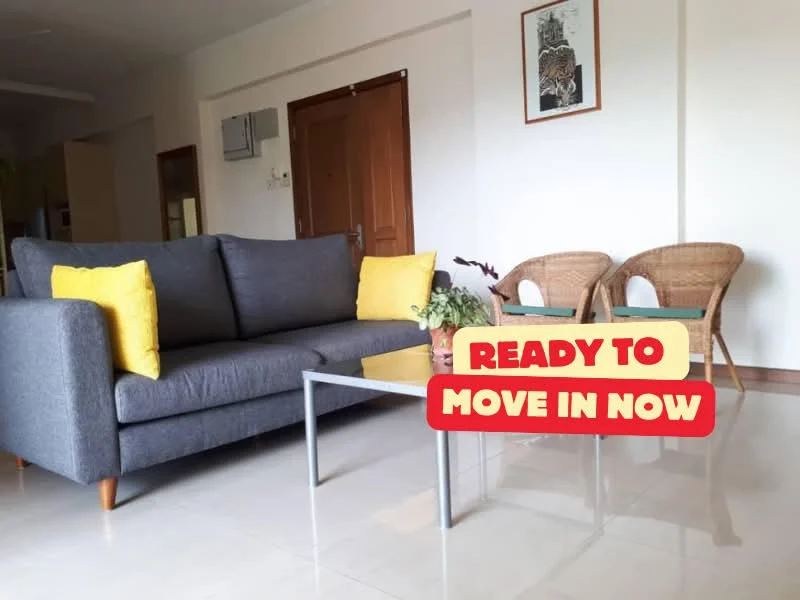 Living features: grey fabric sofa, 2 yellow throw pillows, glass coffee table, ceramic vase with flowers, wall-mounted air conditioning unit, wooden door, light-colored walls, glossy tile flooring, woven rattan chairs; style: modern.