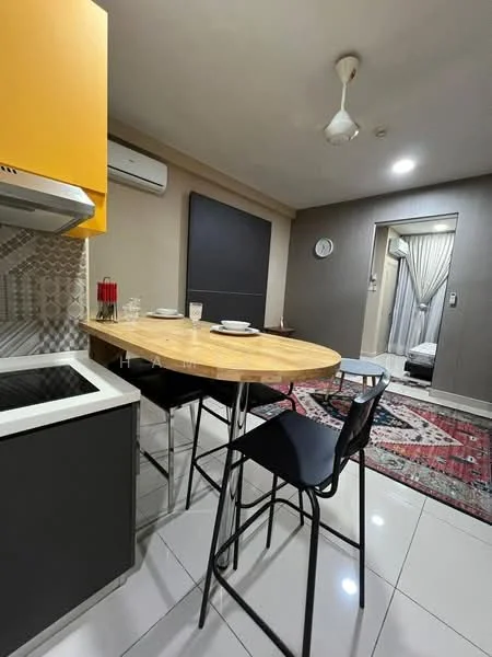 Kitchen features: yellow cabinetry, black bar stools, round wooden dining table, stainless-steel stove, white backsplash with geometric pattern, white tiled flooring, wall-mounted split AC, recessed ceiling lights, decorative area rug, grey painted walls, open layout, kitchen island; style: modern. Dining features: round wooden dining table, black bar stools, table setting with plates and glasses; style: modern. Room features: doorway leading to another room, wall clock, curtains.