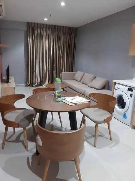 Dining features: round dining table, 4 wooden dining chairs, grey walls, white tiled flooring, sofa in beige fabric, floor-to-ceiling curtains in beige, wall-mounted TV, washing machine, decorative items on table; style: modern.