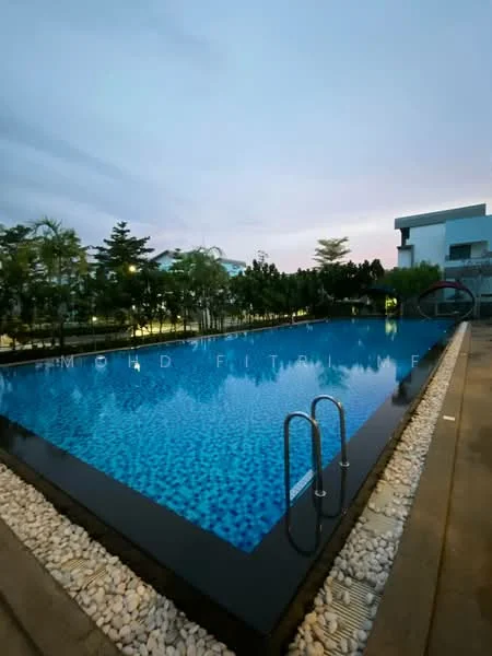 Exterior type: swimming pool deck; features: infinity pool, blue mosaic tile pool surface, black stone coping, landscaped garden surrounding pool, poolside walkway with stone pebbles, night lighting around pool area, lounge chairs visible, fencing around pool area; style: modern.