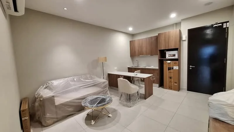 Living features: light grey tiled flooring, white painted walls, sofa covered in plastic, wooden coffee table with metal legs, white upholstered dining chair, kitchenette with wooden cabinetry, built-in microwave, countertop with sink, refrigerator, wall-mounted air conditioning unit, LED ceiling lights, black door, open layout; style: modern.