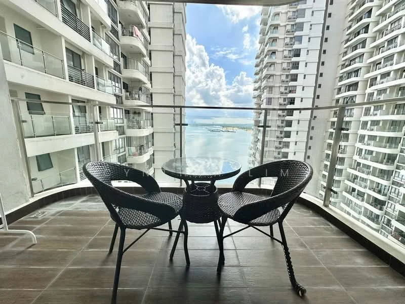 Balcony features: glass railing, outdoor seating with two woven chairs, round glass-top table, tiled flooring, city view, sea view, overhead clouds, high-rise building backdrop; style: modern; view: sea.