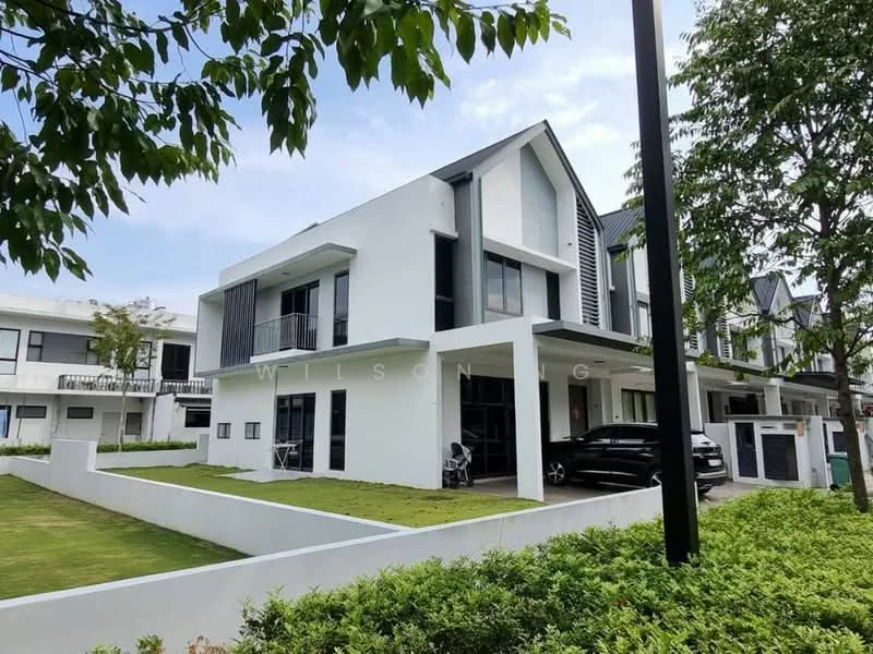 Exterior type: semi-detached house; features: white painted facade, flat roof, two-storey, manicured lawn, mature trees, driveway with interlocking pavers, large windows, balconies with glass railings, modern architectural design, surrounded by greenery; style: modern.