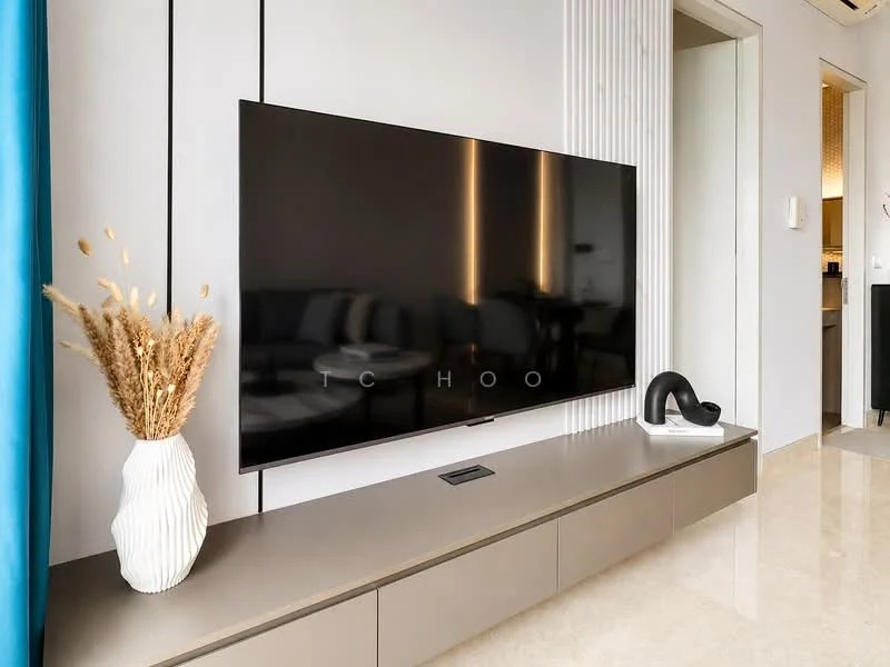 Living features: wall-mounted flat-screen TV, light grey media console, white decorative vase, dried floral arrangement, textured wall paneling, marble flooring, blue curtain, recessed lighting, neutral color palette, modern decor; style: modern.