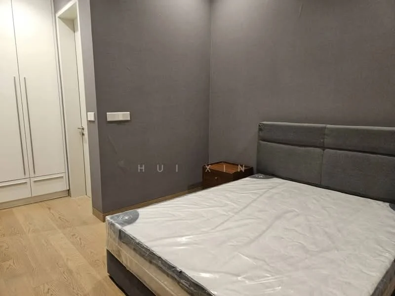 Bedroom features: grey accent wall, wooden flooring, queen-size bed with mattress, upholstered headboard, built-in wardrobe with sliding doors, nightstand, white painted door, light switch; style: modern.