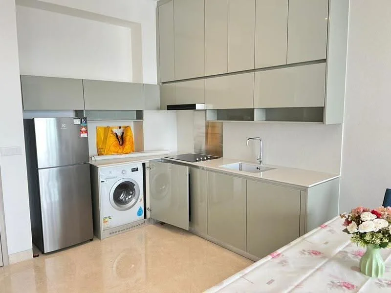 Kitchen features: grey high-gloss cabinetry, white countertop, stainless-steel fridge, front-load washing machine, built-in electric cooktop, single-bowl stainless-steel sink, chrome pull-down faucet, tile backsplash, marble tile flooring, wall-mounted cabinet, decorative artwork on wall; style: modern.