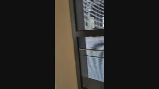 Room features: window with blinds, light-colored walls.