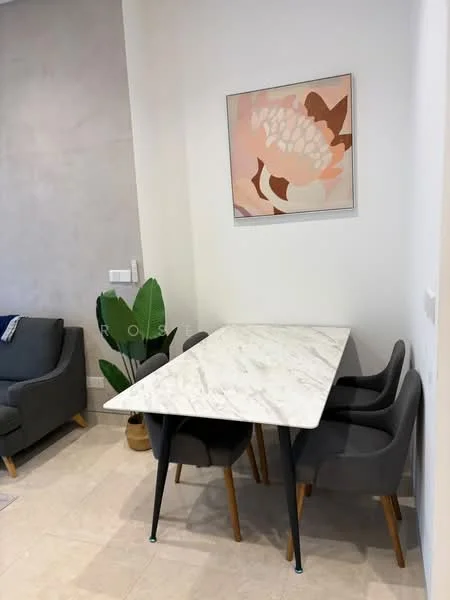 Dining features: marble dining table, 4 grey upholstered dining chairs, framed artwork on wall, light grey wall, potted plant, cream tiled flooring; style: modern.