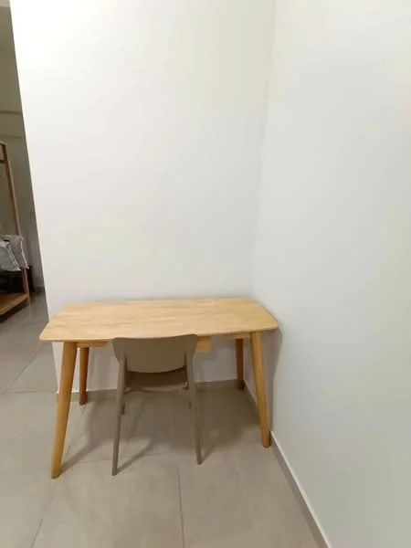 Room features: light wood desk, single chair, white painted walls, tile flooring; style: minimalist.
