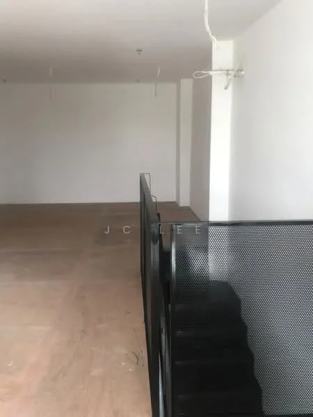 Room features: white painted walls, concrete flooring, metal railing, open space, ceiling with exposed wiring; style: minimalist.