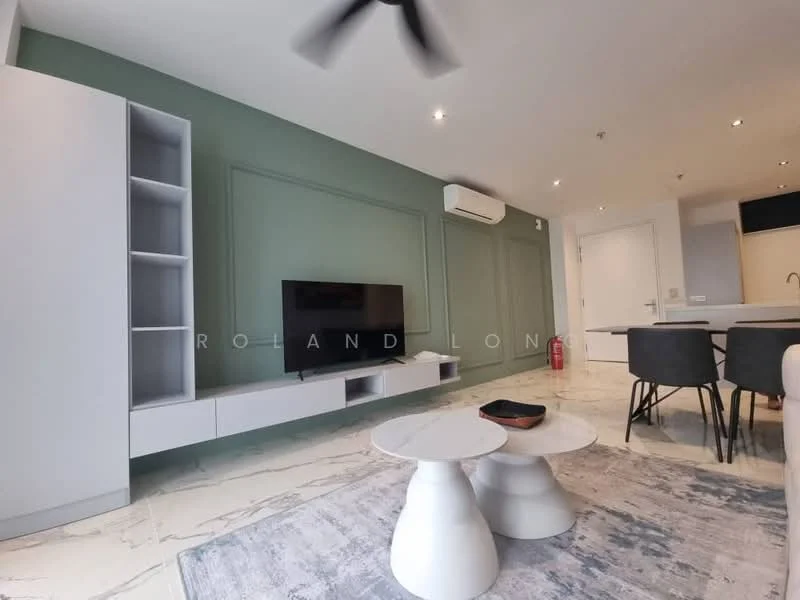 Living features: green accent wall, white painted walls, marble flooring, wall-mounted TV, white TV console, open shelving unit, ceiling fan, area rug with geometric pattern, dining table with chairs in background; style: modern.