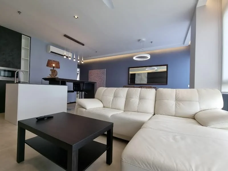 Living features: L-shape sectional sofa in white leather, black coffee table, wall-mounted TV, entertainment unit, recessed downlights, ceiling fan, pendant lighting above kitchen island, open-plan layout with kitchen, grey accent wall, large windows with natural light; style: modern. Kitchen features: kitchen island, black cabinetry, stainless-steel sink, chrome pull-down faucet, built-in appliances, open shelving; style: modern.