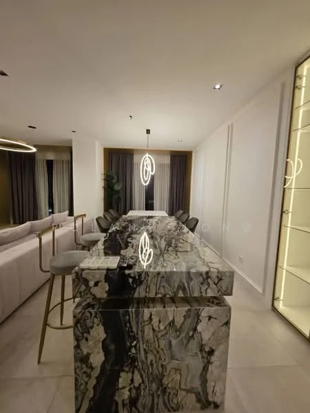Dining features: marble countertop with unique veining, bar stools with gold legs, pendant light fixture, floor-to-ceiling windows with sheer curtains, light-colored walls, neutral-toned flooring, decorative shelving unit, open layout to living area; style: modern; view: city.