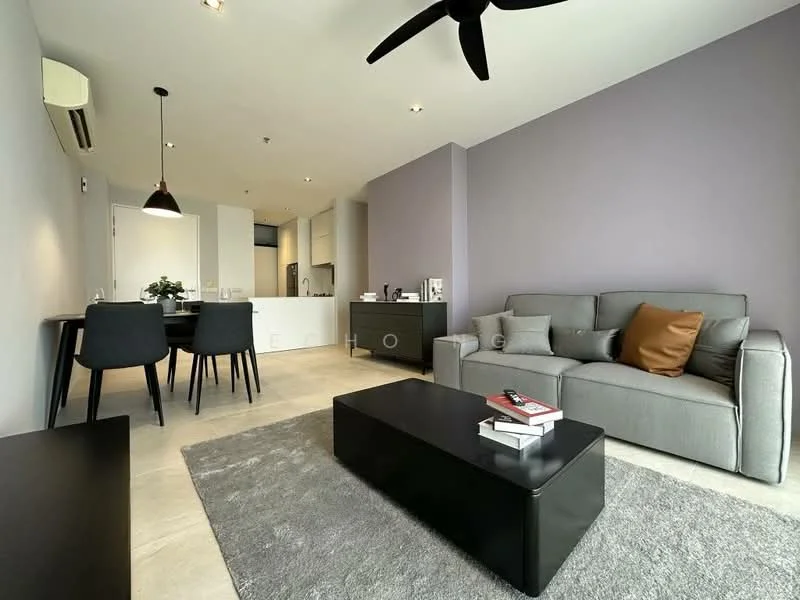 Living features: grey fabric sofa, brown accent pillow, black coffee table, area rug with grey tones, 5-blade ceiling fan, wall-mounted air conditioning unit, pendant light fixture, flat-screen TV on console, decorative books on coffee table; style: modern. Dining features: 4-seater dining table, black dining chairs, open layout to kitchen, minimalist decor; style: modern. Kitchen features: white cabinetry, stainless-steel appliances, countertop with bar seating, open-plan layout, recessed lighting; style: modern.