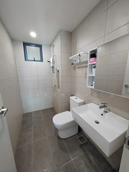 Bathroom features: white wall tiles, grey floor tiles, single-sink vanity with white cabinet, chrome basin mixer faucet, framed mirror, one-piece toilet, shower with wall-mounted showerhead, glass shower enclosure, towel rack, window for natural light, recessed ceiling lights; style: modern.