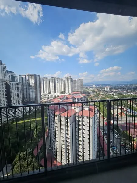 Exterior type: high-rise condominium; features: balcony with railing, city skyline view, surrounded by other high-rise buildings, clear blue sky, green landscaping below, parking area visible, urban setting; style: modern.