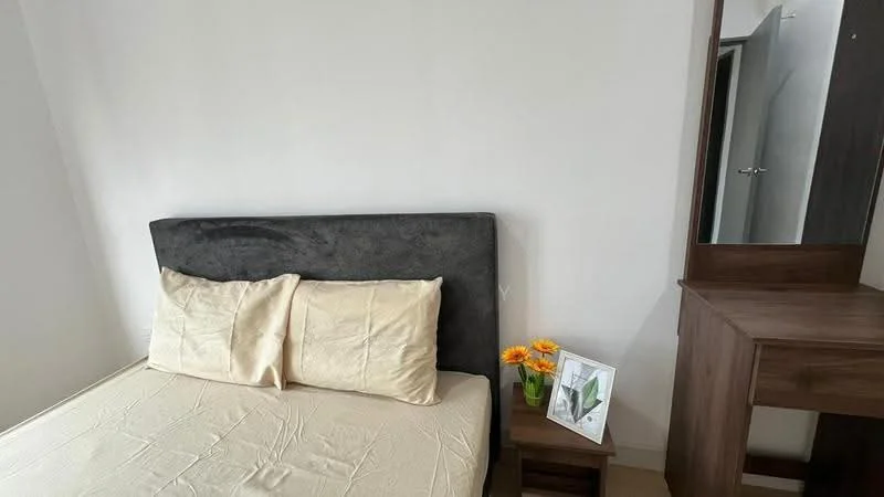 Bedroom features: queen-size bed with upholstered headboard, neutral bedding, wooden bedside table, decorative flowers in vase, framed artwork on bedside table, wooden dressing table, mirror on dressing table, white painted walls, carpeted flooring; style: modern.