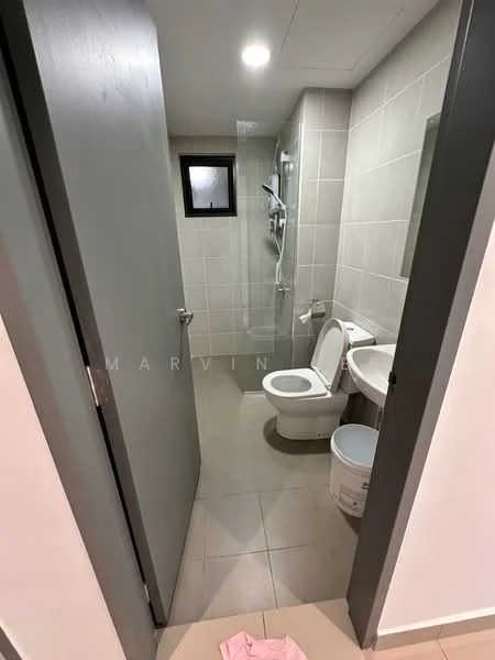 Bathroom features: white toilet, single-sink vanity with cabinet, chrome basin mixer faucet, framed mirror, walk-in shower with glass enclosure, rain shower head, tile flooring, grey wall tiles, small window, light fixture, towel rack; style: modern.