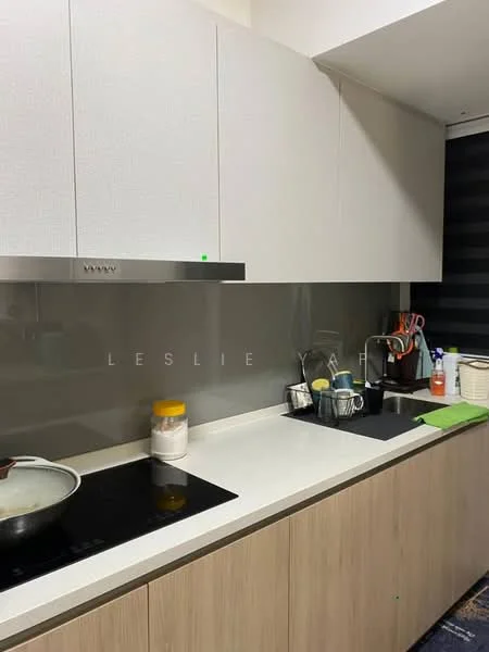 Kitchen features: white cabinetry with flat-panel design, grey glass backsplash, white countertop, induction cooktop, stainless-steel range hood, kitchen utensils on countertop, various containers and bottles, green dish towel, pan on stove; style: modern.