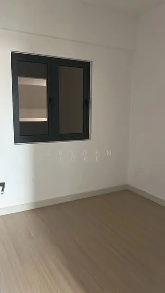 Room features: light wood laminate flooring, white painted walls, black framed window, natural light from window.