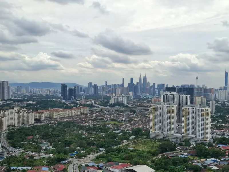 Exterior type: high-rise condominium; features: city skyline view, surrounded by greenery, multiple high-rise buildings, urban landscape, cloudy sky, varied building heights, mixed-use development, residential and commercial buildings; style: modern.