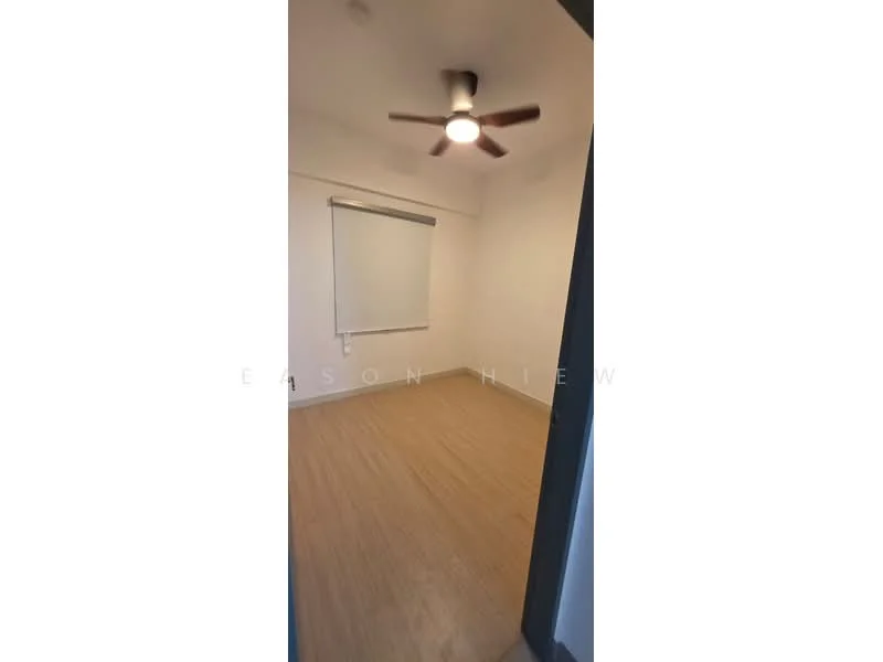 Room features: light wood laminate flooring, white painted walls, ceiling fan with light, roller blinds, single window; style: modern.